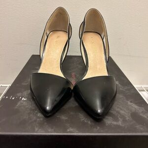 Maiden Lane black heels with cutout ankle.
